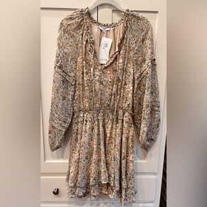 Fate long sleeve dress with gold accents. Size small. New with tags.
